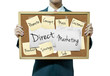 Business man holding board on the background, Direct marketing