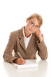 Young businesswoman behind desk