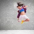 woman dancer screaming and making a difficult jump