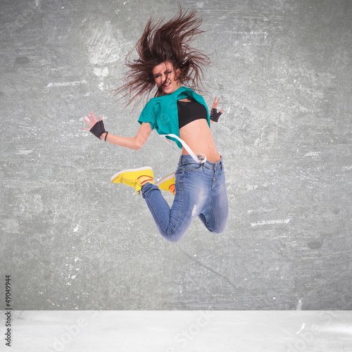 Photo: Young woman dancer jumping Young woman dancer jumping