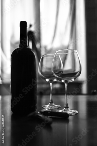 Photo: Glasses and wine bottle B&W image Glasses and wine bottle B&W image