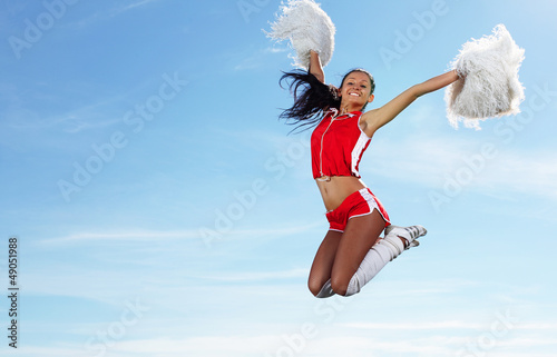 Photo: Young female cheerleader Young female cheerleader