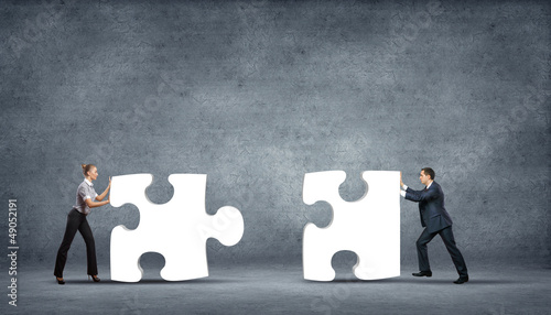 Photo: Piece of puzzle and business persons Piece of puzzle and business persons