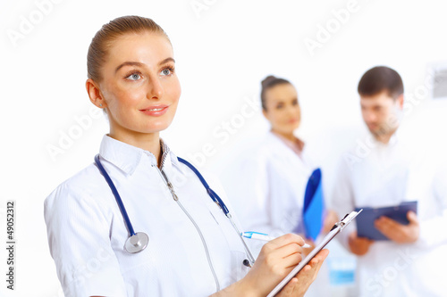 Photo: Young female doctor in white uniform Young female doctor in white uniform