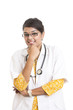 Cheerful Indian young female doctor on white.