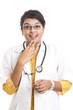 surprised Indian young female doctor on white.