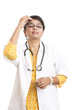 Tensioned Indian young female doctor on white.