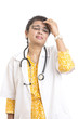 Tensioned Indian young female doctor on white.