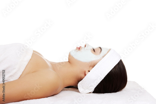Photo: Beautiful woman with clay facial mask Beautiful woman with clay facial mask