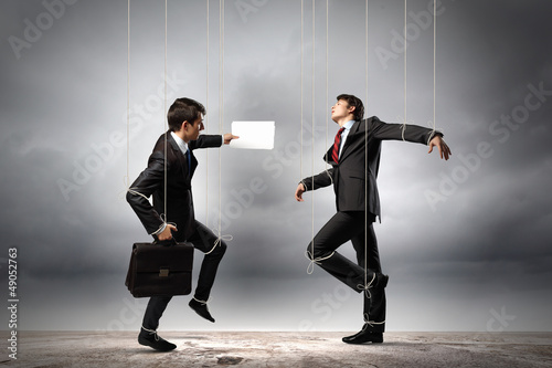 Photo: Puppet businesspeople Puppet businesspeople