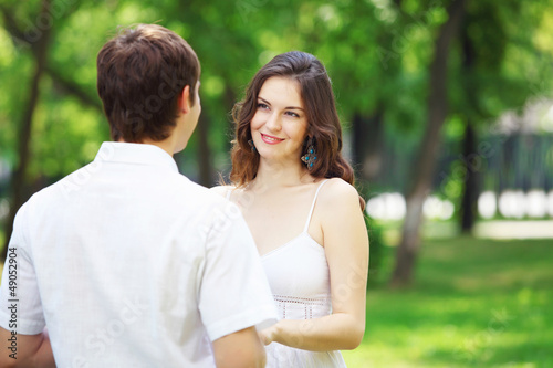 Photo: Young love Couple smiling under blue sky Young love Couple smiling under blue sky