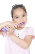 Little smiling girl holding a toothbrush