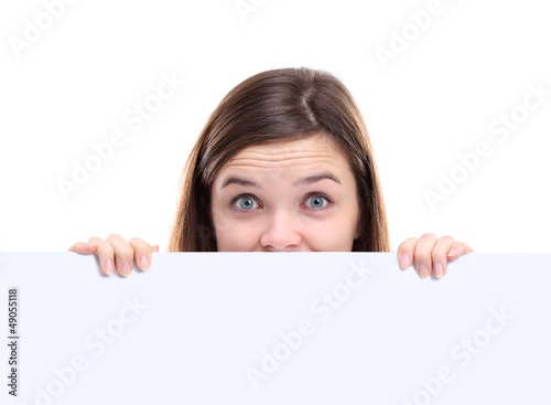 Photo: Banner sign woman peeking over edge of blank empty paper Banner sign woman peeking over edge of blank empty paper