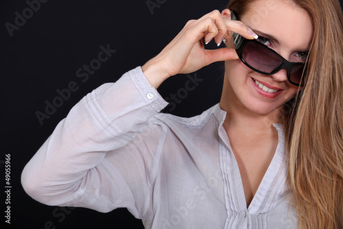 Photo: Attractive woman wearing sunglasses Attractive woman wearing sunglasses