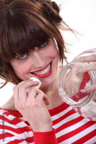 Photo: young woman eating marshmallows young woman eating marshmallows