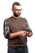 Photo: Young man with beard holding cell phone Young man with beard holding cell phone