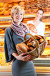 Salesperson with female customer in bakery