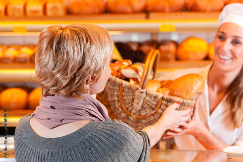 Photo: Salesperson with female customer in bakery Salesperson with female customer in bakery