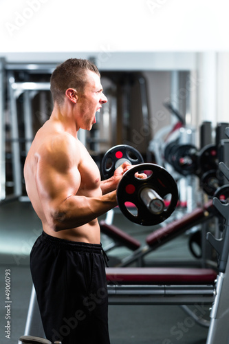 Photo: Dumbbell training in gym Dumbbell training in gym