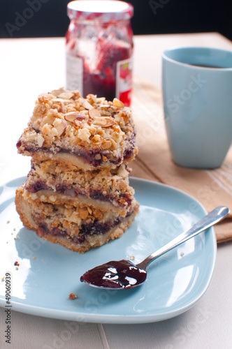 Photo: Spoon with jam and cookie bars Spoon with jam and cookie bars