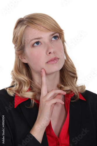 Photo: A pensive cute businesswoman. A pensive cute businesswoman.