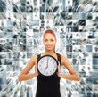 A redhead woman holding a clock on a business background