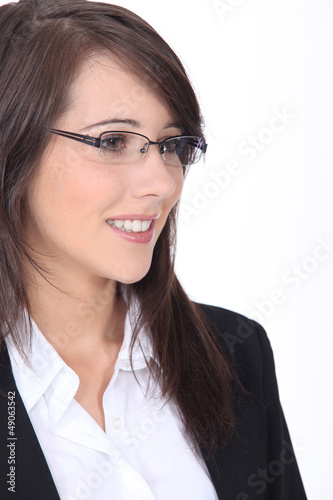 Photo: Profile of young brunette office worker Profile of young brunette office worker