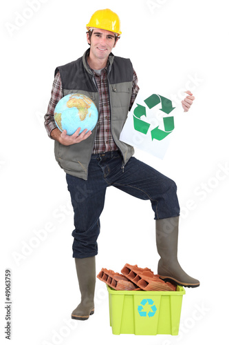 Photo: craftsman holding a recycling label craftsman holding a recycling label