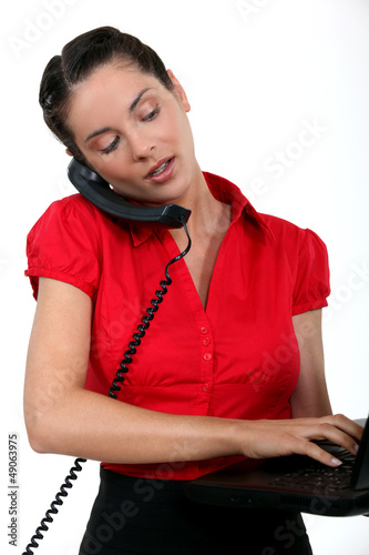 Photo: A busy female executive. A busy female executive.