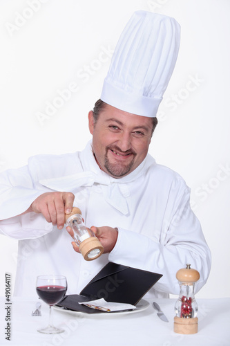 Photo: cook salting a bill cook salting a bill