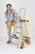 portrait of cabinetmaker posing near ladder