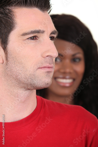 Photo: Woman smiling and serious man Woman smiling and serious man