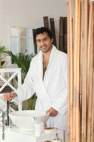 Photo: Man at the bathroom sink Man at the bathroom sink