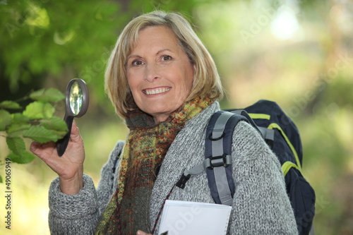 Photo: Woman with magnifying glass Woman with magnifying glass