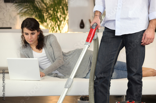 Photo: Man vacuuming Man vacuuming