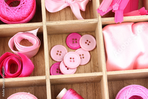 Photo: Material for sewing in wooden box closeup Material for sewing in wooden box closeup