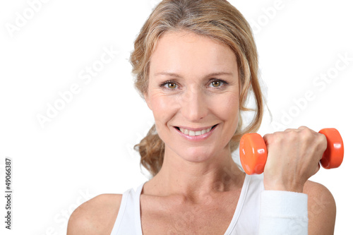 Photo: woman with dumbbell woman with dumbbell