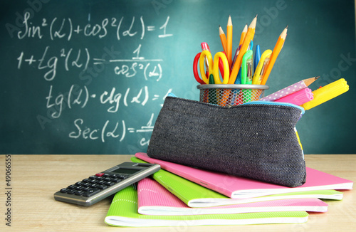 Photo: Back to school - blackboard with pencil-box and school Back to school - blackboard with pencil-box and school