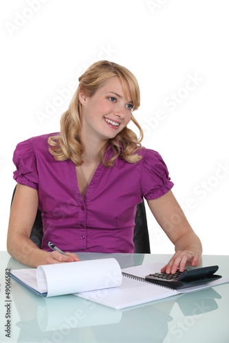 Photo: Accountant using calculator Accountant using calculator