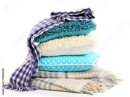 Photo: Hill colorful pillows and plaids isolated on white Hill colorful pillows and plaids isolated on white