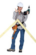 Woman making wooden truss