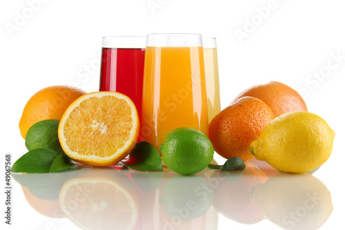 Photo: Glasses of juise with leafs and fruits isolated on white Glasses of juise with leafs and fruits isolated on white