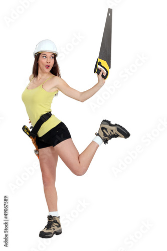 Photo: Woman doing pirouettes with a handsaw Woman doing pirouettes with a handsaw