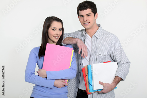 Photo: Students holding folders Students holding folders