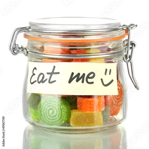 Photo: Multicolor candies in glass jar, isolated on white Multicolor candies in glass jar, isolated on white