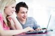 Two college students having fun studying together