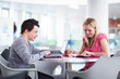 Two college students having fun studying together