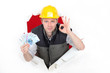 craftsman holding money and making an okay sign