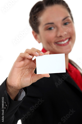 Photo: young businesswoman holding business card young businesswoman holding business card