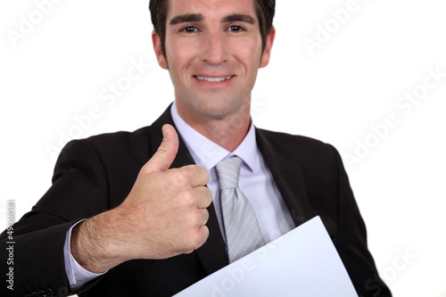 Photo: A businessman giving the thumb up. A businessman giving the thumb up.
